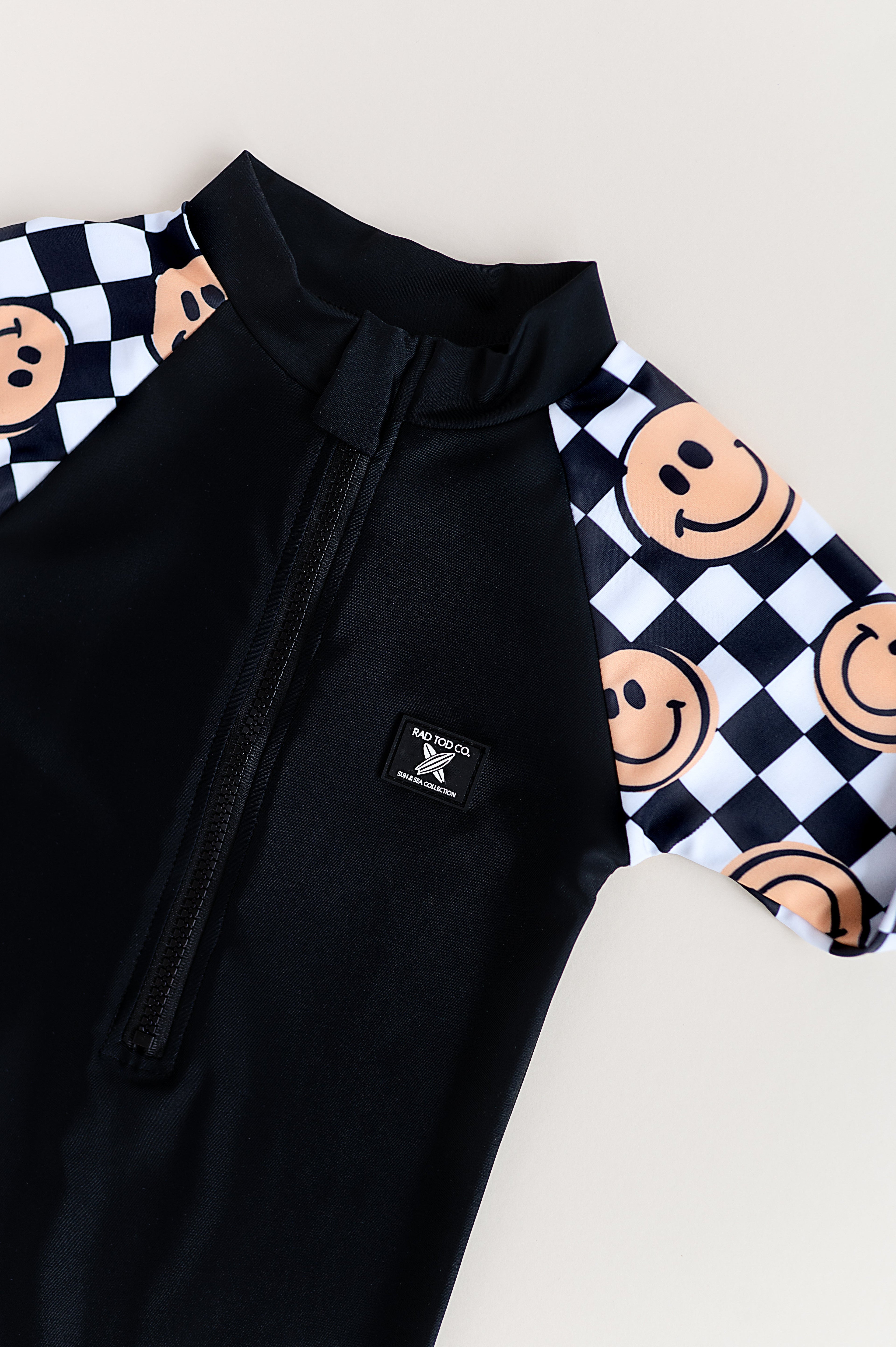 UPF 50 RASHGUARD ONESIE - HAPPY SURF