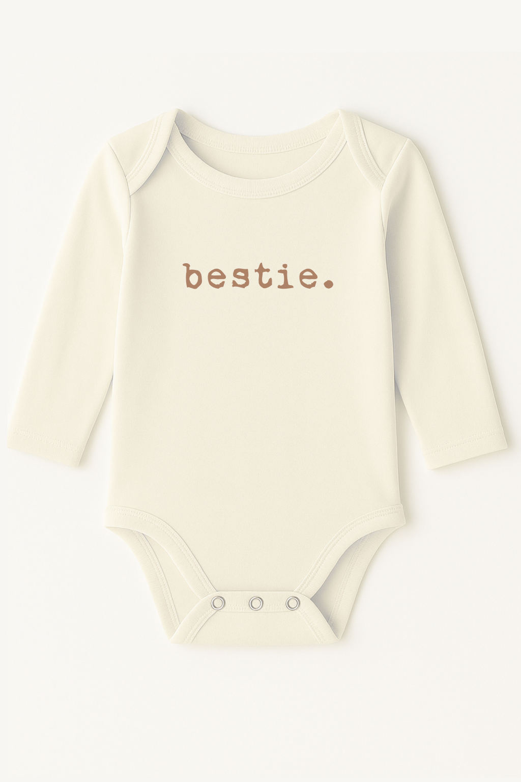 Baby onesie with 'bestie.' text on a white background