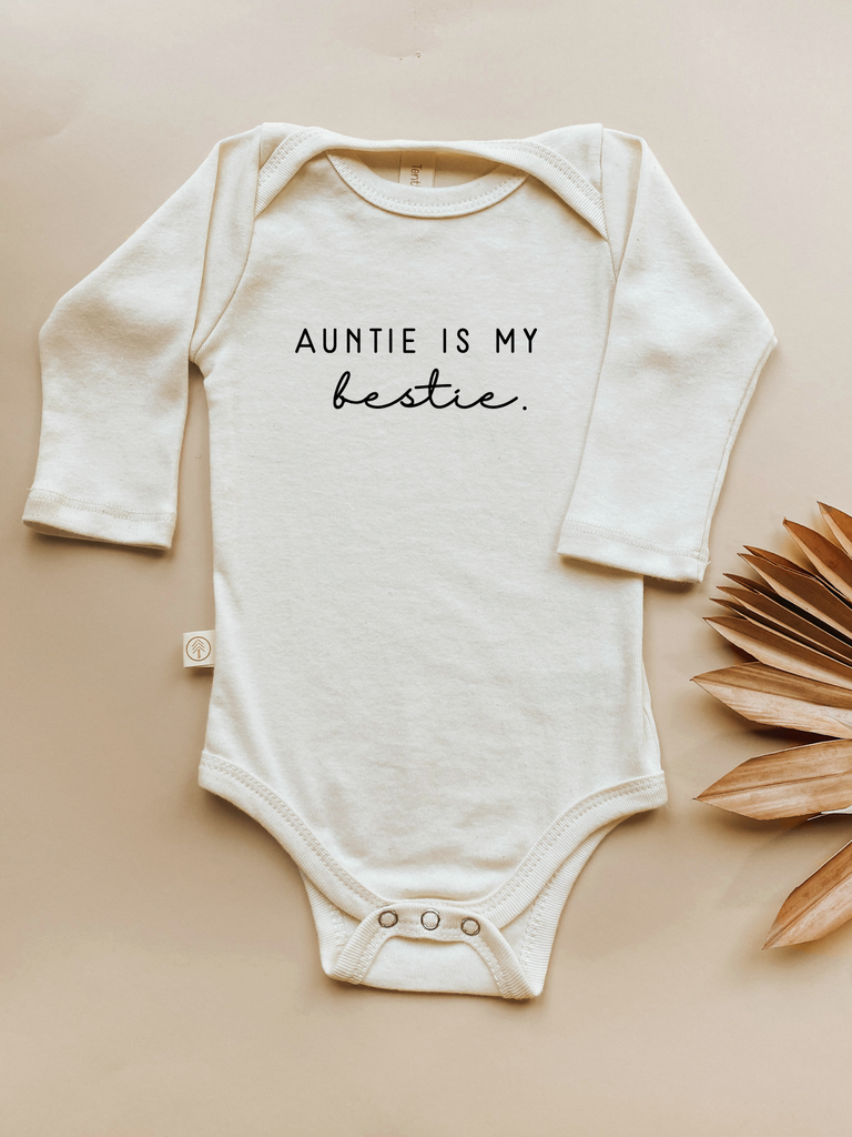 organic cotton long sleeve bodysuit with auntie is my bestie graphic made in usa perfect for new baby baby shower gift for sister aunt onzie onsie onesie tenth and pine